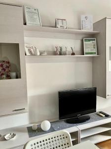 TV a/nebo společenská místnost v ubytování Casa Gaia- Castelnuovo del Garda
