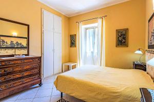 Postel nebo postele na pokoji v ubytování Palazzina GiardinoLago + 31 fotografií