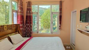 Postel nebo postele na pokoji v ubytování Green Valley View Homestay