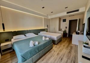 Hotel Umma客房内的一张或多张床位