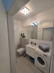 Kúpeľňa v ubytovaní Apartament Turkusowy Kołobrzeg Podczele
