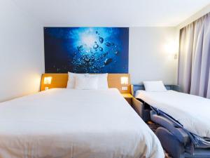 Postel nebo postele na pokoji v ubytování Novotel Saint Avold