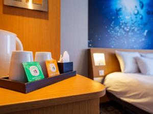Postel nebo postele na pokoji v ubytování Novotel Saint Avold