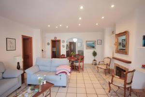 a living room with a couch and a table at Can Canto Mediterranea x 6 pax in Sa Ràpita