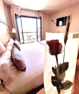 Posteľ alebo postele v izbe v ubytovaní Hotel Real