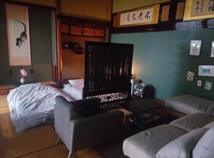 Postel nebo postele na pokoji v ubytování 駅前宿舎 禪 shared house zen