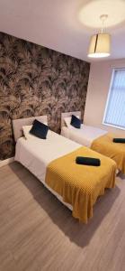 En eller flere senge i et værelse på City centre 4 bed 8 guest house