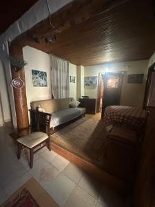 A bed or beds in a room at Kont Pension