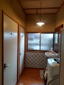 Koupelna v ubytování 駅前宿舎 禪 shared house zen