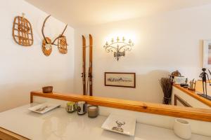 a kitchen with a counter top and a mirror at Cervinia ski escape with Plateau Rosa view and garage in Breuil-Cervinia +31 photos