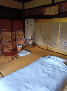 Postel nebo postele na pokoji v ubytování 駅前宿舎 禪 shared house zen
