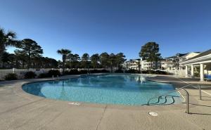 a large swimming pool in a parking lot at Relax, Beach, Golf, Shop, Repeat resort in Calabash