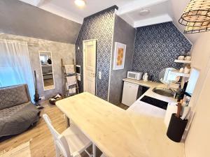 a kitchen and living room with a table and a dining room at Guesthouse in Kärdla in Kärdla