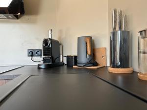 a kitchen counter with various appliances on top of it at G10 Apartments in Akureyri +9 photos