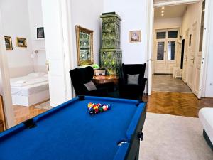 a living room with a pool table and a bedroom at Christoph's Central Apartment in Budapest