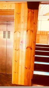 a staircase in a train station with a escalator at Hotel New Urvashi in Jāmb