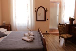 Postel nebo postele na pokoji v ubytování Giovanna Boutique Rooms & Pool