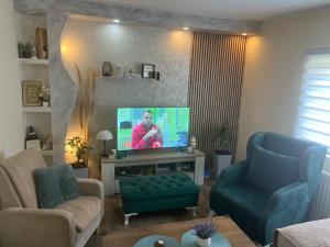 TV a/nebo společenská místnost v ubytování Tea i Una