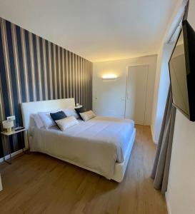 Postel nebo postele na pokoji v ubytování Hotel Baia di Paré