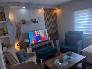 TV a/nebo společenská místnost v ubytování Tea i Una