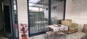 a patio with a table and chairs on a balcony at Berat GuestHouse "AAA" in Berat +24 photos