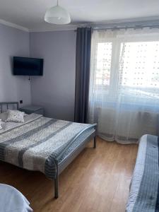 Postel nebo postele na pokoji v ubytování ADA - pokoje gościnne