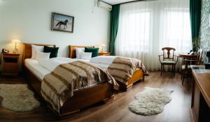 Ένα ή περισσότερα κρεβάτια σε δωμάτιο στο Septimia Hotels & Spa Resort