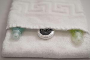a close up of two syringes on a white towel at Spacious 1 Bedroom Apartment in Central Birmingham in Birmingham +12 photos