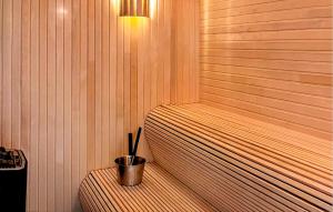 a corner of a sauna with a bucket in it at Beautiful Apartment In Idre With Sauna in Idre