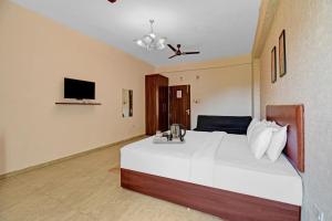 Postel nebo postele na pokoji v ubytování Townhouse Classio Suites