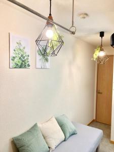 Ένα ή περισσότερα κρεβάτια σε δωμάτιο στο 4min Shinjuku by sub Cozy Mini Room +7 φωτογραφίες