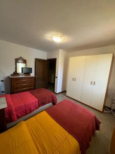 Postel nebo postele na pokoji v ubytování Appartamento Gallicano - La Tana