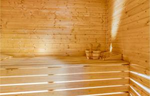 a wooden sauna with a bucket in it at Lovely Home In Buzim With Sauna in Bužim