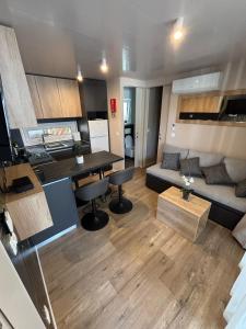 a living room with a couch and a table at Mobile homes Eva in Biograd na Moru