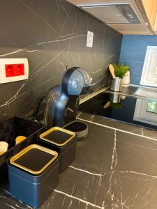 a bathroom with a sink with two bins in it at Mobile homes Eva in Biograd na Moru