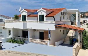 a white house with a red roof at 1 Bedroom Nice Apartment In Hvar in Hvar