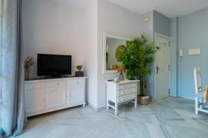 TV a/nebo společenská místnost v ubytování Panther Home Ipanema + 9 fotografií