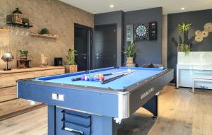 a blue pool table in a living room at 1 Bedroom Lovely Apartment In Visé in Visé