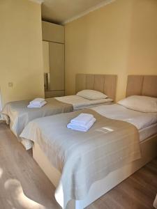 Postel nebo postele na pokoji v ubytování Guest House Gulba
