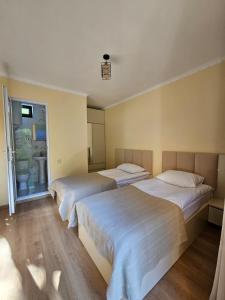 Postel nebo postele na pokoji v ubytování Guest House Gulba