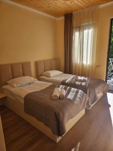 Postel nebo postele na pokoji v ubytování Guest House Gulba