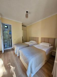 Postel nebo postele na pokoji v ubytování Guest House Gulba