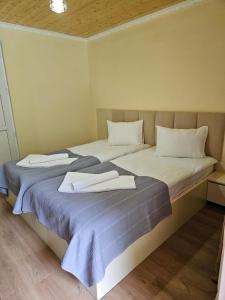 Postel nebo postele na pokoji v ubytování Guest House Gulba