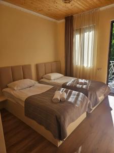 Postel nebo postele na pokoji v ubytování Guest House Gulba