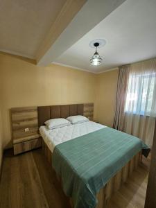 Postel nebo postele na pokoji v ubytování Guest House Gulba