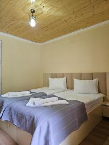 Postel nebo postele na pokoji v ubytování Guest House Gulba