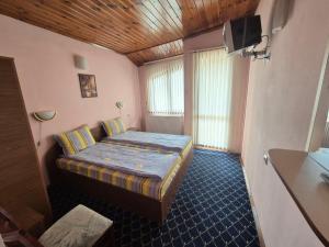 Ένα ή περισσότερα κρεβάτια σε δωμάτιο στο Aseva House Guest house