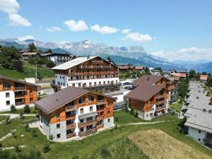 an aerial view of a village with buildings at TERRESENS - Les Fermes du Mont-Blanc in Combloux