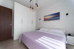 Postel nebo postele na pokoji v ubytování Viola lido adriano