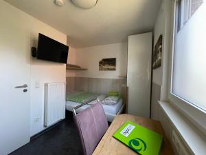 TV a/nebo společenská místnost v ubytování Birkenhain 2a - Lastering Ferienhäuser & Apartments